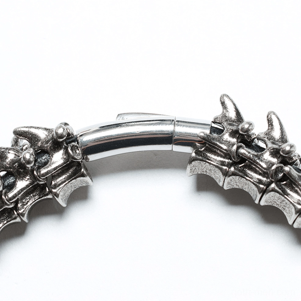 Front close-up of choker clasp showing realistic bone texture and secure snap fastener in silver metal