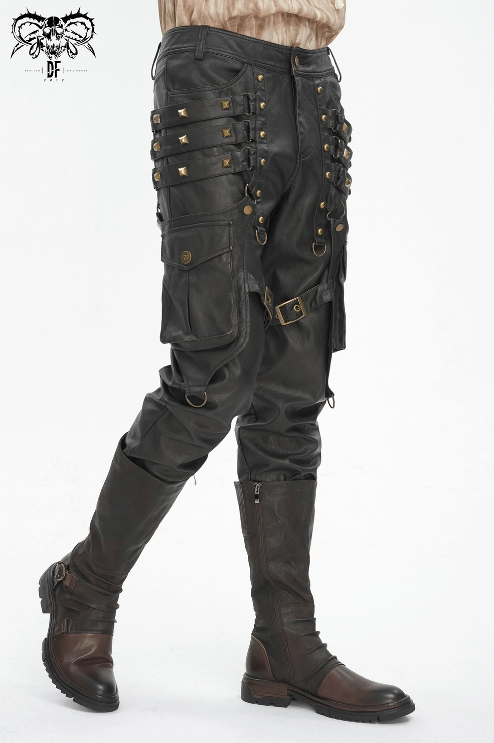 Close-up of bronze stud placement and leather texture on men's gothic punk faux leather pants