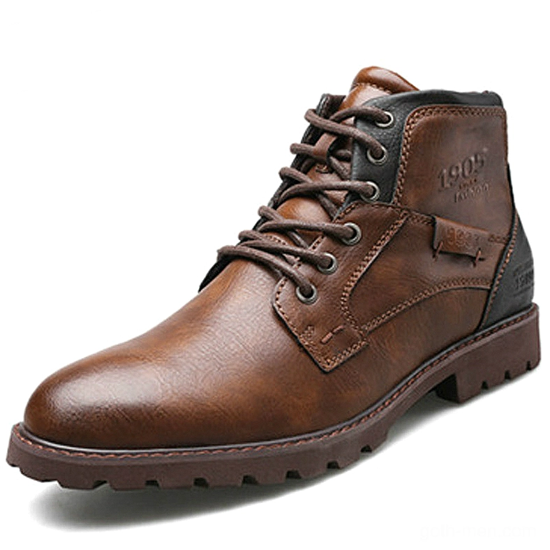 Single brown leather gothic ankle boot with vintage branding and dark sole, side profile