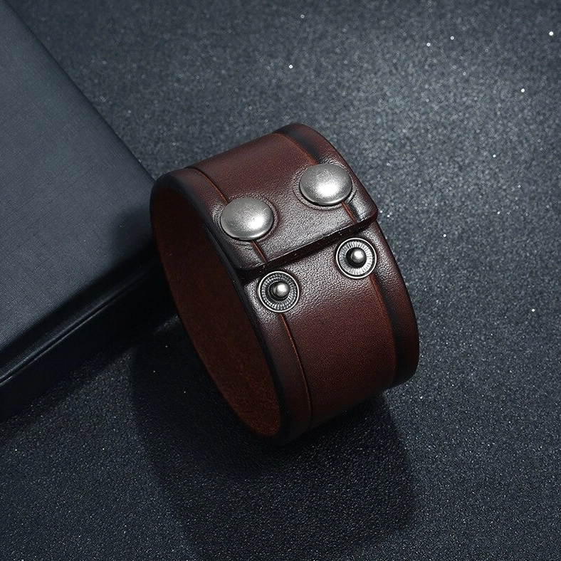 Brown wide leather gothic cuff bracelet top view revealing metal round snap fastener hardware