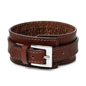 Brown punk rock leather wristband with stitched double-layer straps and silver clasp, front flat lay view