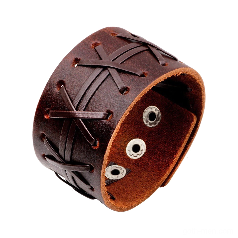 Dark brown leather wide cuff bracelet oblique close-up, displaying suede inner lining and authentic cross-stitch craftsmanship