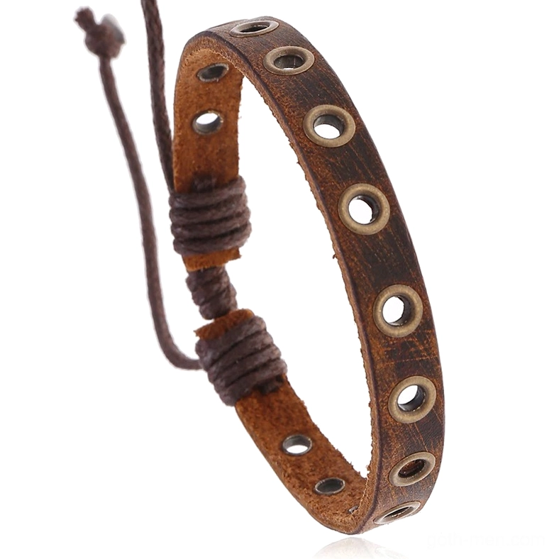 Distressed brown leather gothic bracelet with metal grommet eyelets, top-down close-up view