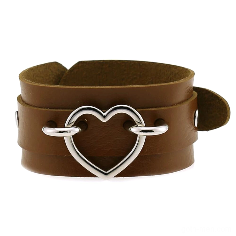 Brown leather double-layer heart cuff bracelet with silver heart decoration, earthy gothic fashion accessory flat lay