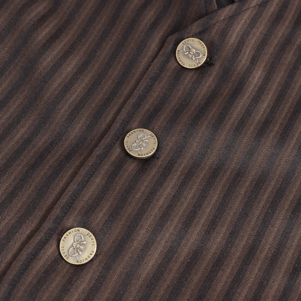 Close-up detail of brown pinstriped gothic waistcoat embossed metal buttons on pinstriped fabric