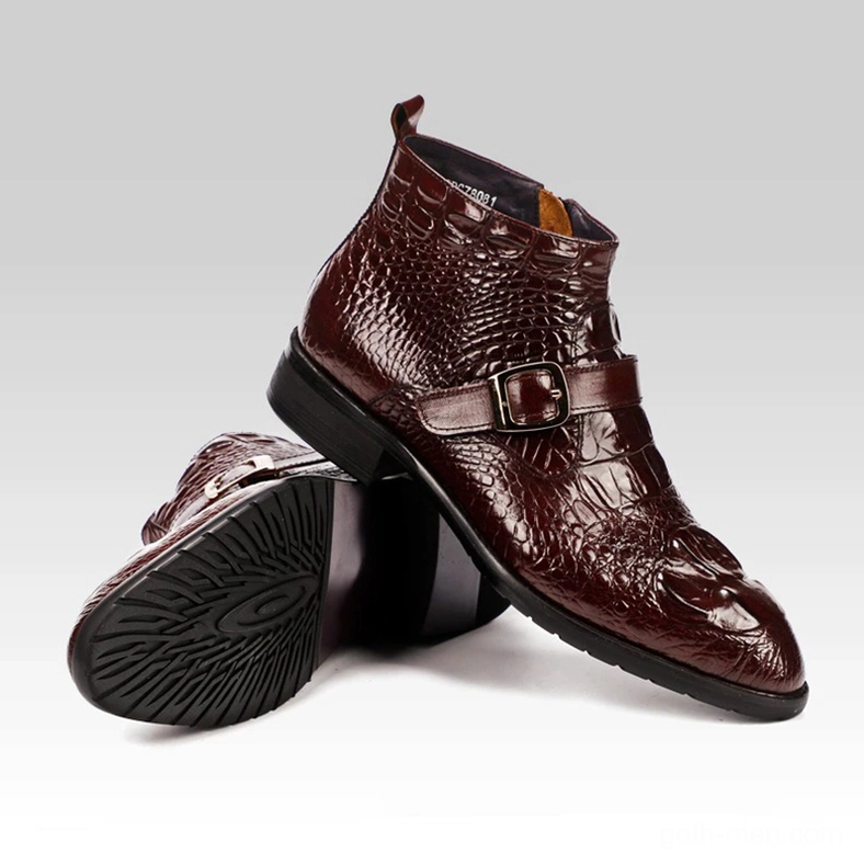 Burgundy crocodile textured gothic boots pair crossed arrangement highlighting leather texture and buckle