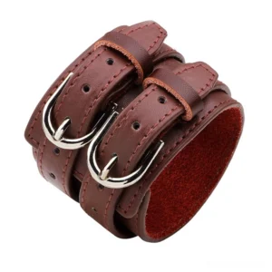 Burgundy leather gothic cuff bracelet revealing red suede inner lining and silver metal hardware, showcasing the luxurious textural contrast of the double-strap design