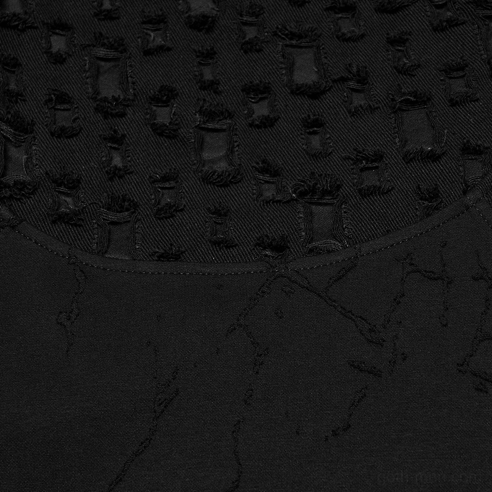 Burnout knit fabric texture close-up, cracked frayed pattern, matte black finish with distressed surface detail