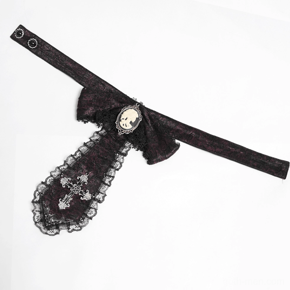 Low-angle angled flat lay of burgundy Gothic cravat showing snap fastener and pendant