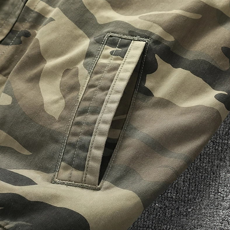 Camo denim bomber jacket on model demonstrating fit and drape, military style alternative clothing worn look
