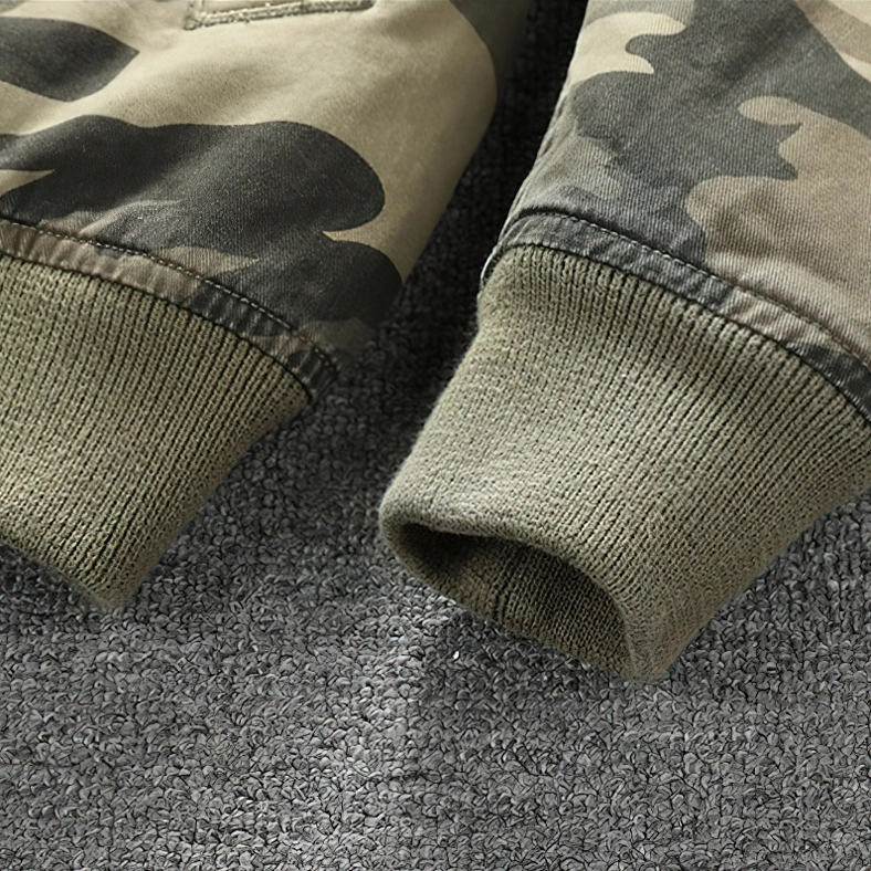 Industrial gothic camo denim zip jacket worn with band merchandise, dark fashion styling inspiration