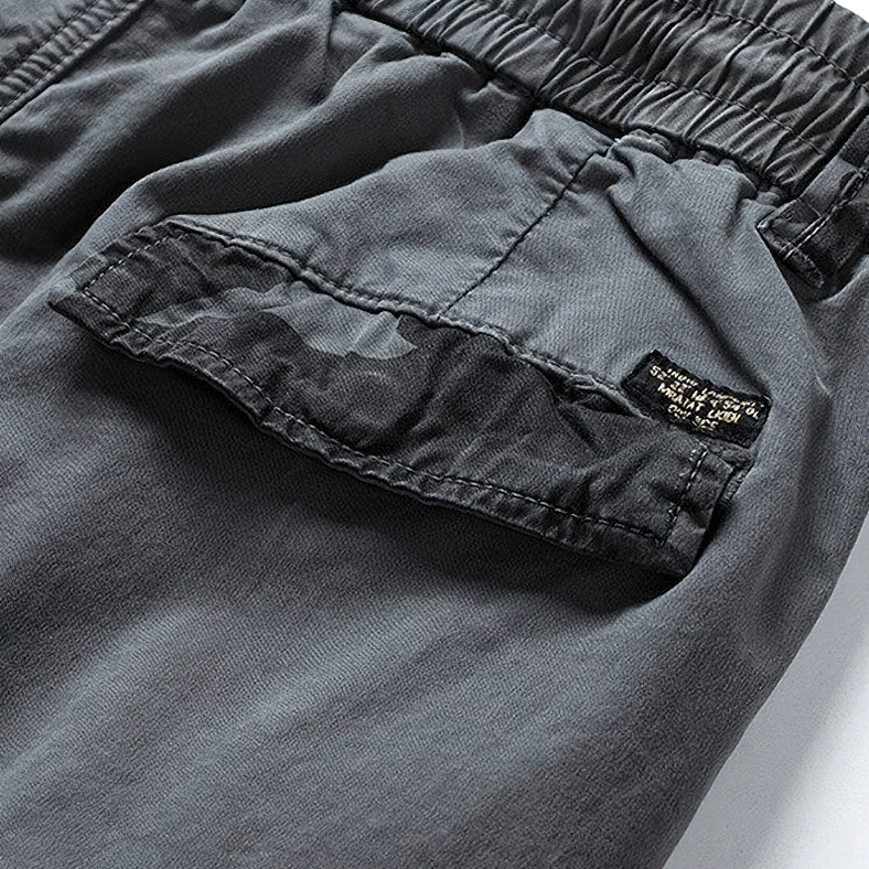 Camouflage cargo pocket flap detail with branded fabric label gothic streetwear
