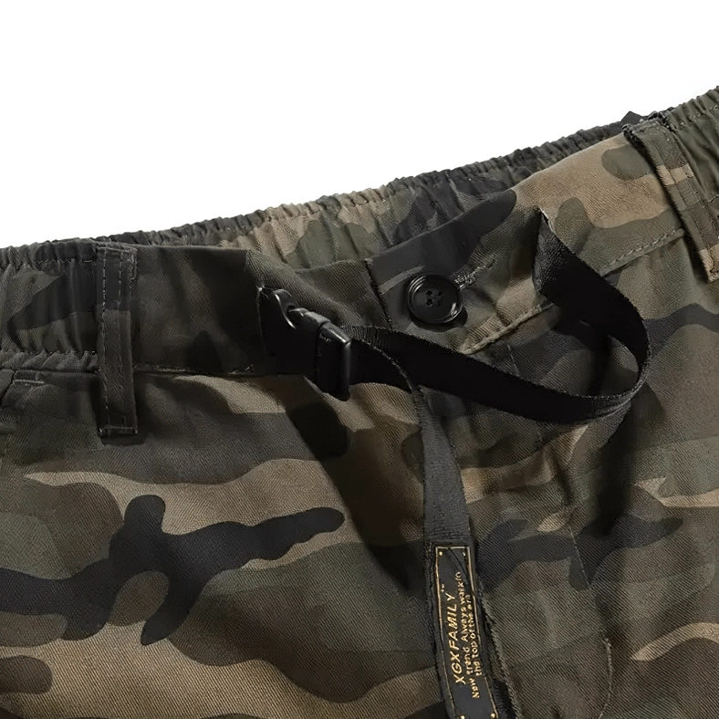 Close-up of camouflage cargo pants waist with elastic band and adjustable webbing strap