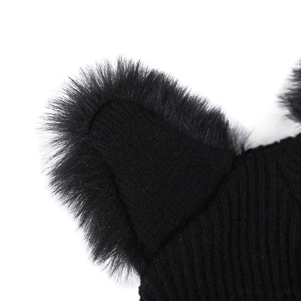 Close-up side view of fuzzy faux fur cat ear trim on black knitted beanie showing texture and craftsmanship