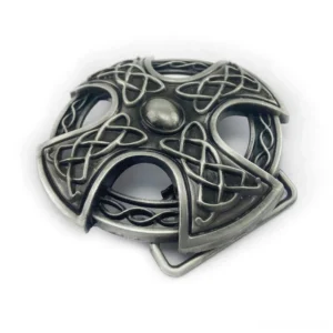 Celtic cross belt buckle with antique silver finish and intricate engraved knot design, front oblique angle view showing dimensional detail