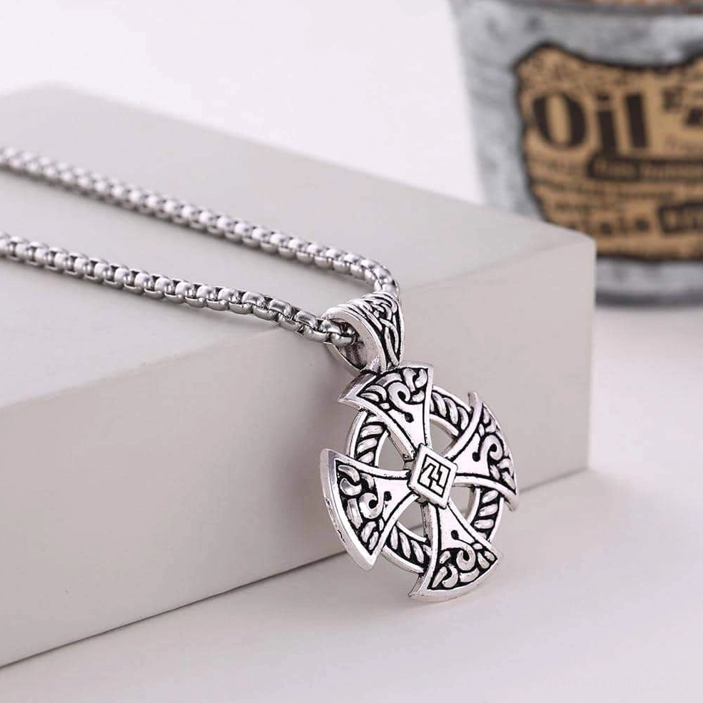 Antique silver Celtic cross pendant with engraved knotwork patterns, wheat link chain with vintage background styling