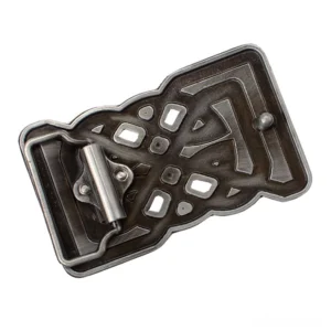 Rear side of gothic belt buckle showing metal snap-fit fastener and hollow carved Celtic knot details, top-down oblique view