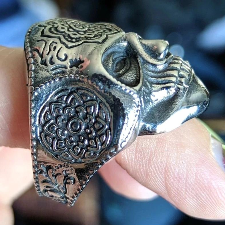 Mandala skull ring left rear view highlighting Celtic knot engravings and vintage silver tone patina development