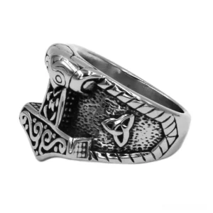 Celtic trinity knot ring side view showing twisted rope border and embossed Nordic details on stainless steel band