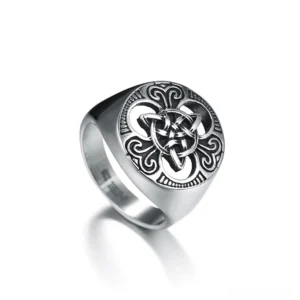 Celtic trinity knot stainless steel signet ring with vintage silver finish and engraved Celtic pattern, front side oblique view