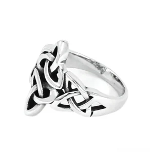 Celtic triquetra knot signet ring with hollowed knot details, three-quarter side view showcasing intricate geometric design on stainless steel band