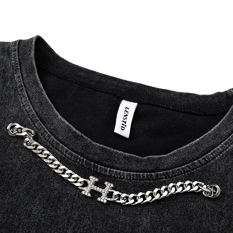 Silver-toned metal chain with rhinestone H charm attached to gothic tank neckline