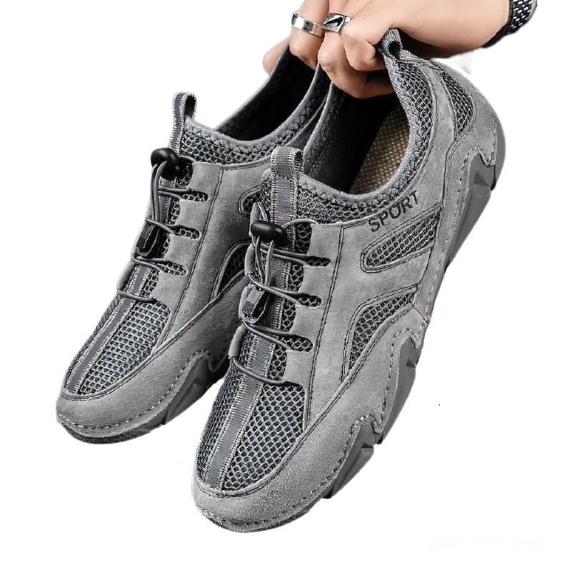 Dark charcoal grey leather mesh sneakers with suede panels - frontal side angle view