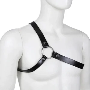 Black leather chest harness displayed on male mannequin showing front perspective with central metal O-ring and adjustable buckle strap detail