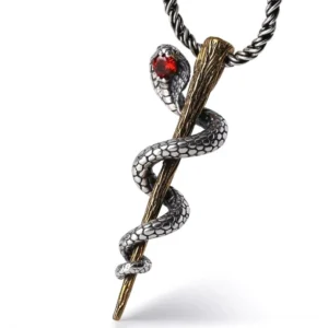 Sterling silver cobra staff pendant with red gemstone eyes on white background - gothic snake jewelry