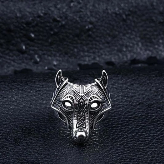 Compact gothic wolf head ring with Celtic engravings, antique silver stainless steel, front straight angle on black leather
