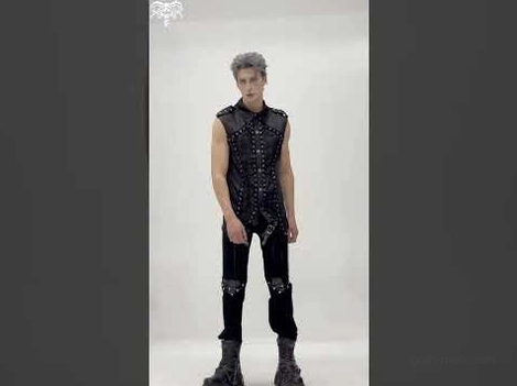 Full goth punk outfit featuring studded harness leather pants with sleeveless vest on male model