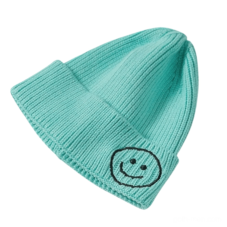 Cyan turquoise knit beanie with black smiley face embroidery, alternative winter hat