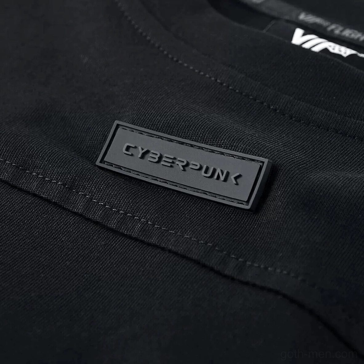 Embossed cyberpunk rubber patch badge on chest of gothic tactical t-shirt