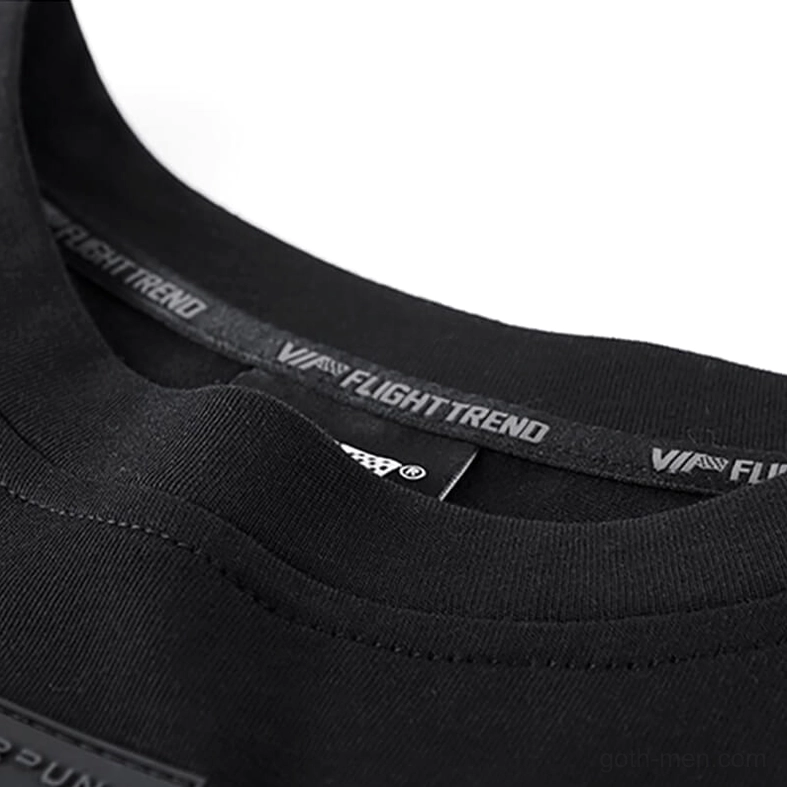 O-neck collar close-up detail with branded trim and inner tag on gothic cyberpunk tee