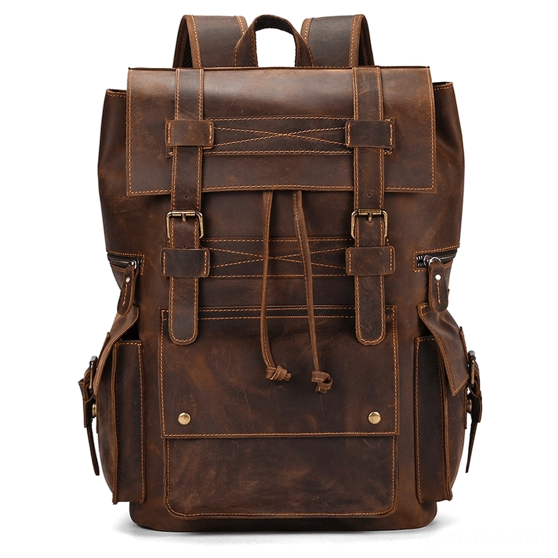 Dark brown leather gothic backpack with flap cover and multiple buckle fasteners - full front view