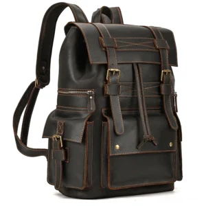 Dark brown genuine leather gothic backpack with rivet reinforcements and contrast stitching - front oblique view
