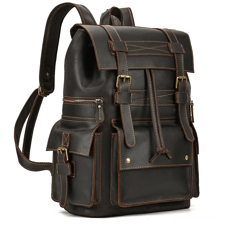 Dark brown genuine leather gothic backpack with rivet reinforcements and contrast stitching - front oblique view
