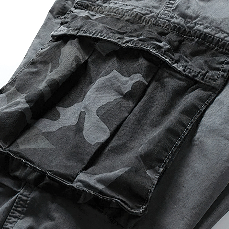 Dark camo textile pocket detail showing fabric weave and construction quality