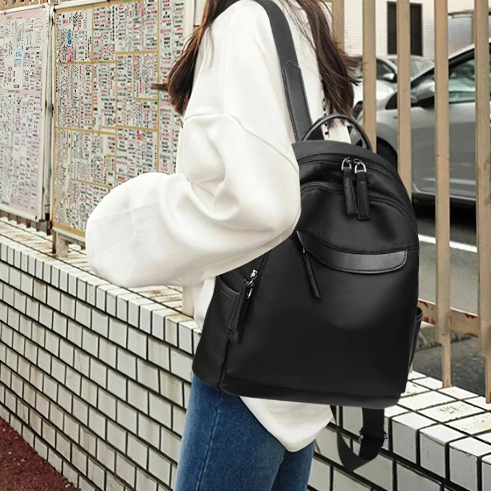 Dark gothic backpack interior organization cell phone pocket storage solution