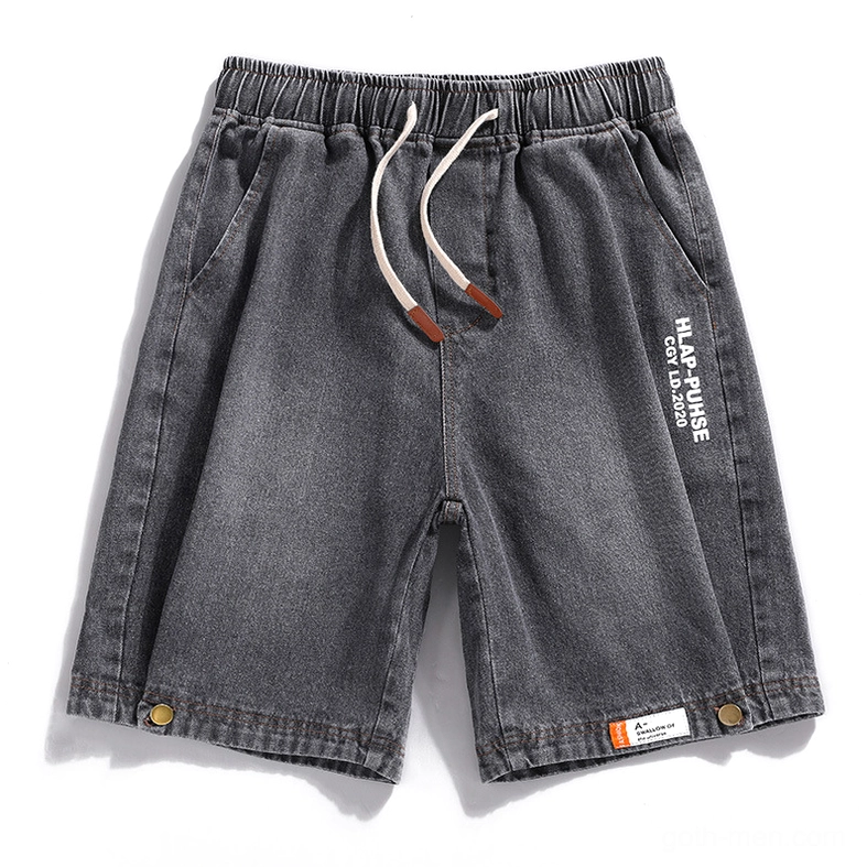 Dark grey gothic denim shorts with drawstring waist and embossed prints, front display on white background