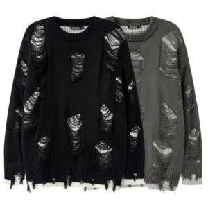 Distressed oversized gothic crew neck sweater in black and dark gray - front flat lay view showing ripped knit details