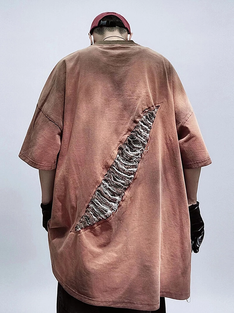 Dark brown distressed T-shirt rear three-quarter view showing back ripped patch and oversized drape