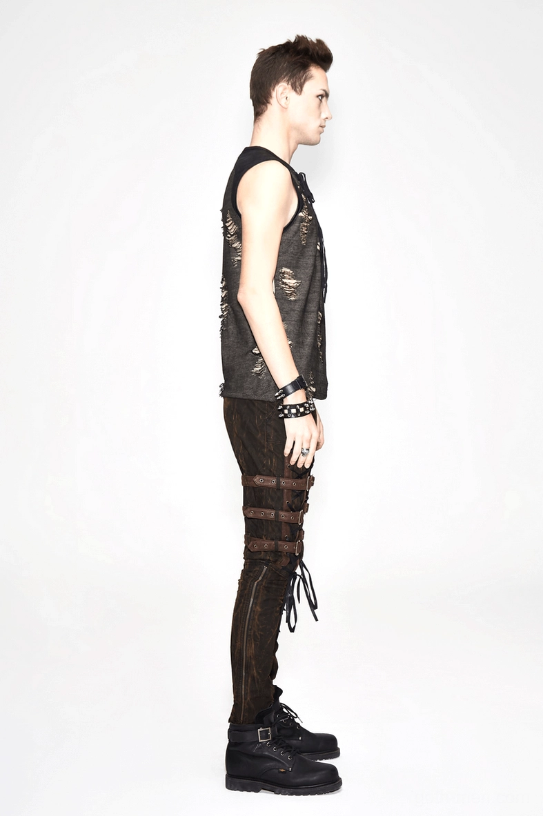 Side profile of distressed grunge tank top on model paired with lace-up pants and platform boots
