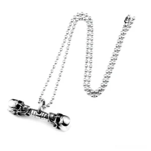 Double skull pendant necklace overhead view beaded chain dark goth aesthetic