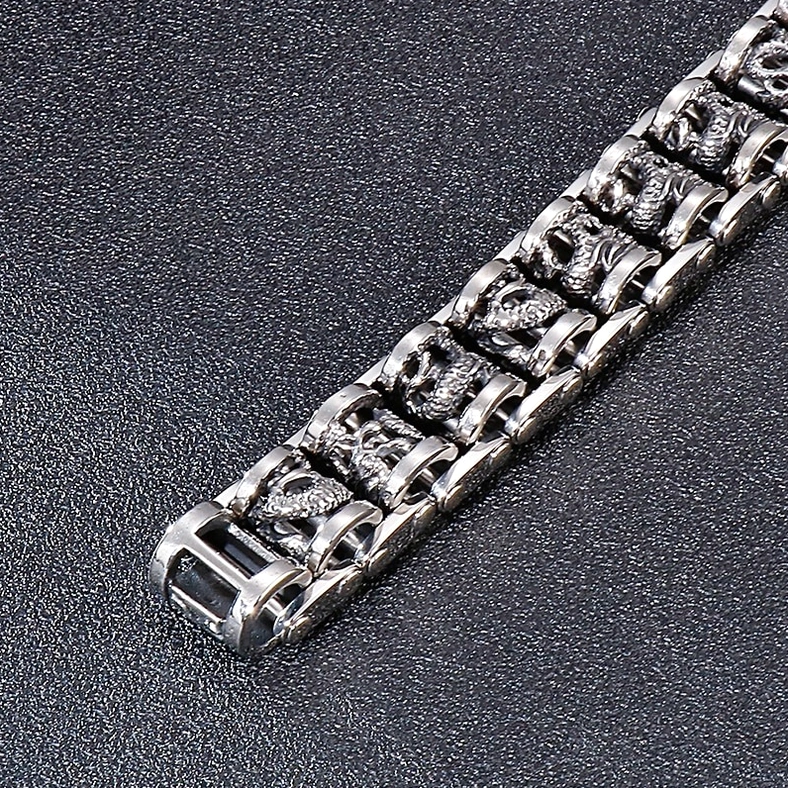 Dragon bracelet close-up showing clasp vintage silver finish detailed dragon carvings