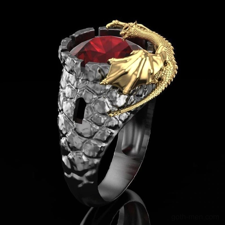 Gunmetal dragon wrap ring with large red center stone and golden coiled dragon detail on black background
