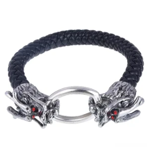 Dragon head silver clasp gothic leather bracelet with red gemstone eyes - front view flat lay product shot