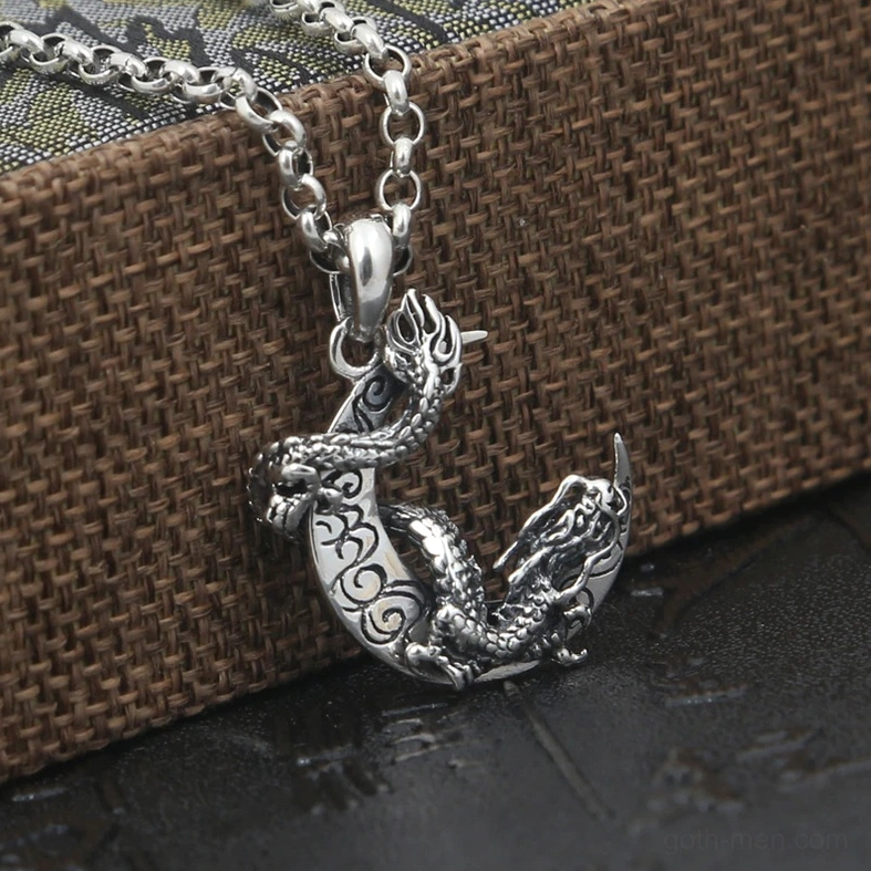 Gothic dragon moon necklace pendant side profile view showing twisted dragon wrapped around crescent with antique patina