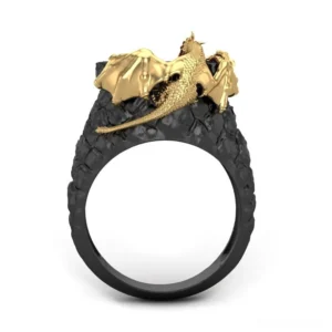 Side profile of gothic dragon ring showing lying dragon motif on rugged textured black band with golden details