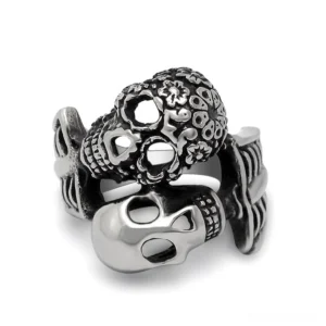 Dual skull gothic ring stainless steel front view darkened details on white background